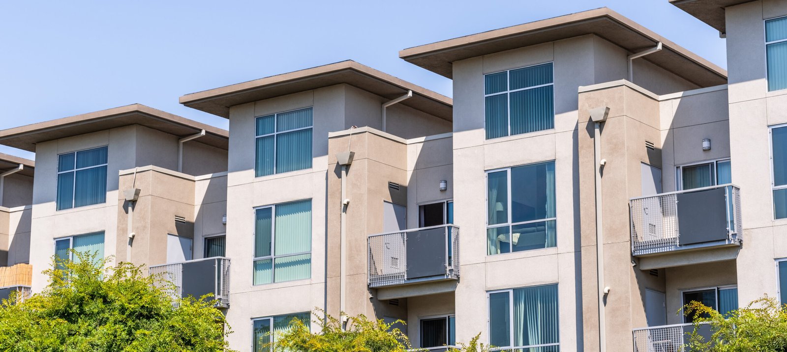 exterior view of modern apartment building offering luxury renta